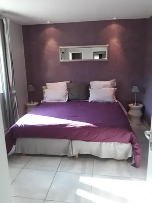 Un ou plusieurs lits dans un hébergement de l'établissement Guest House Domaine des Grouilleres
