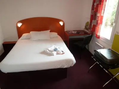 Un ou plusieurs lits dans un hébergement de l'établissement Quick Palace Lyon Saint-Priest
