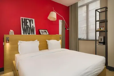 Un ou plusieurs lits dans un hébergement de l'établissement Maison Nô - Hôtel et Rooftop