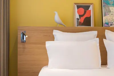 Un ou plusieurs lits dans un hébergement de l'établissement Maison Nô - Hôtel et Rooftop