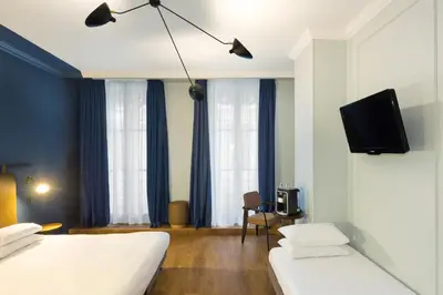 Un ou plusieurs lits dans un hébergement de l'établissement Hôtel Silky by HappyCulture