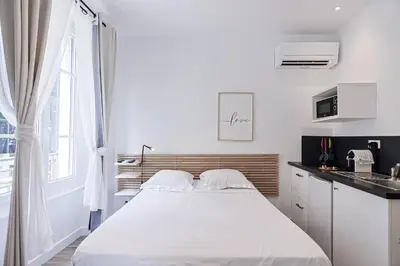 Un ou plusieurs lits dans un hébergement de l'établissement LES BULLES DE MONA - Zen - Spa - Clim