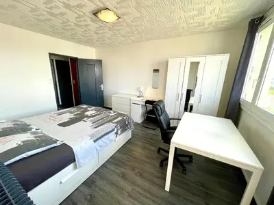 Un ou plusieurs lits dans un hébergement de l'établissement Belle chambre privée en colocation G