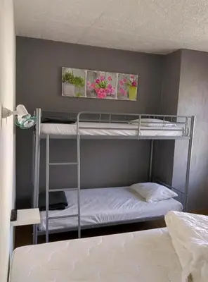 Un ou plusieurs lits dans un hébergement de l'établissement Cit'Hôtel La Résidence