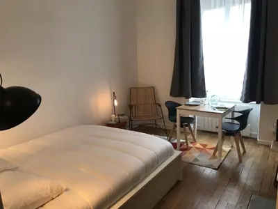 Un ou plusieurs lits dans un hébergement de l'établissement Le Joyau de Jouhaux appartement G - Lyon Garibaldi