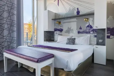 Un ou plusieurs lits dans un hébergement de l'établissement Lagrange Aparthotel Lyon Lumière