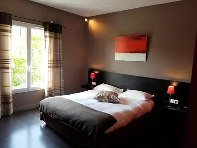 Un ou plusieurs lits dans un hébergement de l'établissement Hôtel Le Domaine des Vignes Ampuis Lyon Sud Vienne