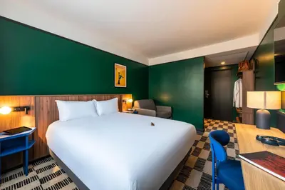 Un ou plusieurs lits dans un hébergement de l'établissement Hotel Le Lumière