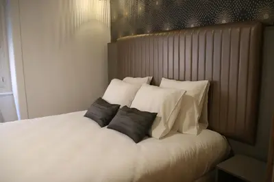 Un ou plusieurs lits dans un hébergement de l'établissement Hotel Saint Vincent