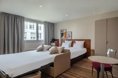 Un ou plusieurs lits dans un hébergement de l'établissement Spark by Hilton Lyon Ouest
