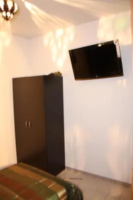 Télévision ou salle de divertissement dans l'établissement L'Acilya