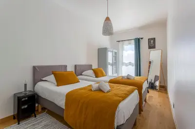 Un ou plusieurs lits dans un hébergement de l'établissement MAISON STELLA