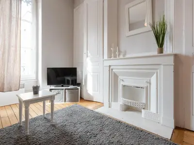 Télévision ou salle de divertissement dans l'établissement Le Nid Lyonnais - Le Vienne