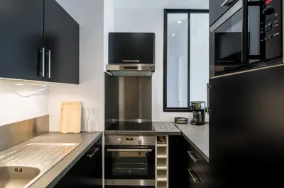 Cuisine ou kitchenette dans l'établissement Honorê - Suite Barre