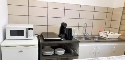 Cuisine ou kitchenette dans l'établissement Appart comme chez soi