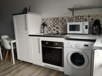 Cuisine ou kitchenette dans l'établissement Immeuble La DOA proche CHU
