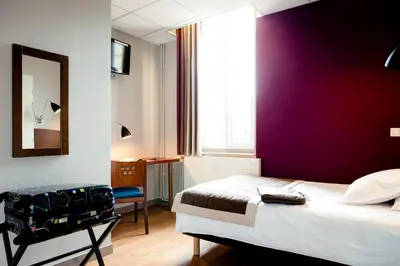Un ou plusieurs lits dans un hébergement de l'établissement Domaine Lyon Saint Joseph