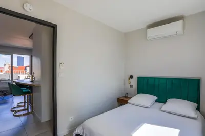Un ou plusieurs lits dans un hébergement de l'établissement Lyon Premium - 7e Ciel Rooftop Panoramique