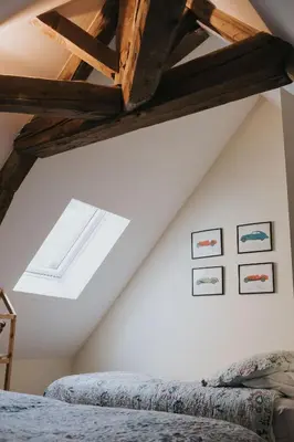 Un ou plusieurs lits dans un hébergement de l'établissement Lyon Country House - Suites & Tour de Garde