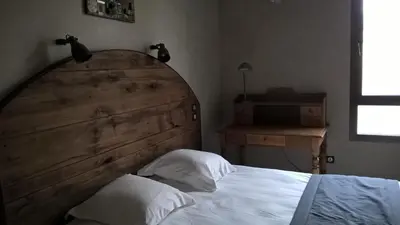 Un ou plusieurs lits dans un hébergement de l'établissement Les Chalets de Maramour