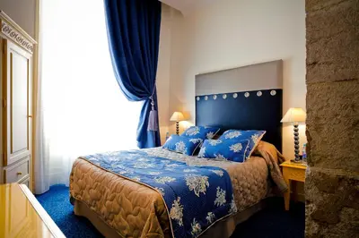 Un ou plusieurs lits dans un hébergement de l'établissement Grand Hotel des Terreaux