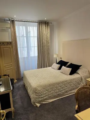 Un ou plusieurs lits dans un hébergement de l'établissement Grand Hotel des Terreaux