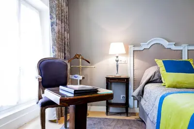 Un ou plusieurs lits dans un hébergement de l'établissement Grand Hotel des Terreaux