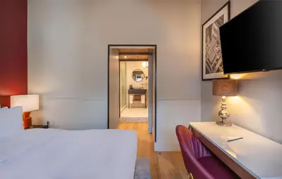 Un ou plusieurs lits dans un hébergement de l'établissement Cour des Loges Lyon, A Radisson Collection Hotel