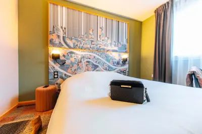 Un ou plusieurs lits dans un hébergement de l'établissement Ibis Styles Lyon Croix Rousse