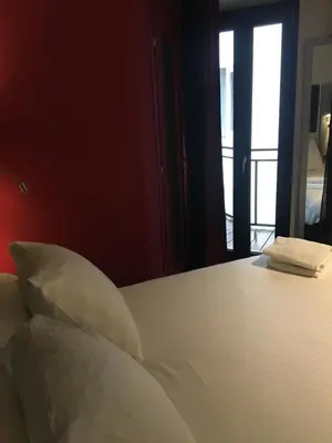 Un ou plusieurs lits dans un hébergement de l'établissement Hôtel Boutique Richelieu, Lyon Gare Part-Dieu