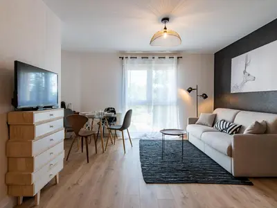 Télévision ou salle de divertissement dans l'établissement Le Piccandet