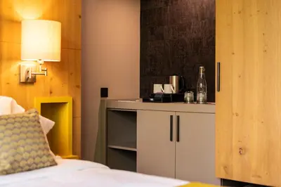 Un ou plusieurs lits dans un hébergement de l'établissement Domaine du Gouverneur, Hôtel, Restaurant & Golf