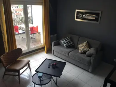 Coin salon dans l'établissement Résidence Studio Grand Luxe Wifi parking privé