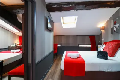 Un ou plusieurs lits dans un hébergement de l'établissement Hôtel Alexandra