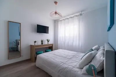 Télévision ou salle de divertissement dans l'établissement Cocoon Appart 1 Miribel