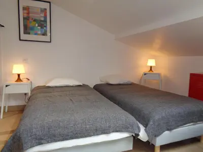 Un ou plusieurs lits dans un hébergement de l'établissement Maison cosy avec jardin dans les Monts du Lyonnais - FR-1-496-174
