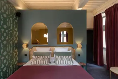 Un ou plusieurs lits dans un hébergement de l'établissement MiHotel Tour Rose
