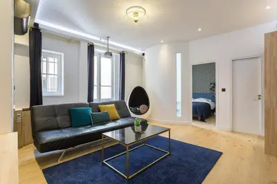 Un ou plusieurs lits dans un hébergement de l'établissement Hamac Suites - Lyon le Bellecour