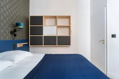 Un ou plusieurs lits dans un hébergement de l'établissement Hamac Suites - Lyon le Bellecour