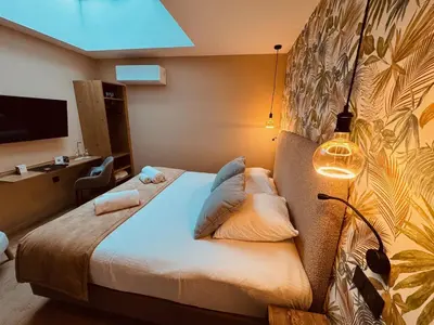 Un ou plusieurs lits dans un hébergement de l'établissement Domaine de Suzel Hôtel & Spa