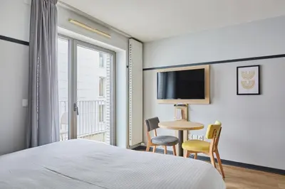 Télévision ou salle de divertissement dans l'établissement Appart'hôtel Odalys City - Lyon Centre Confluence
