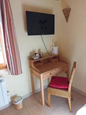 Télévision ou salle de divertissement dans l'établissement Le Moulin de l'Etang