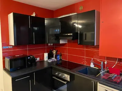 Cuisine ou kitchenette dans l'établissement Maison proche Lyon Centrale du Bugey