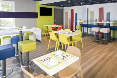 Restaurant ou autre lieu de restauration dans l'établissement Hotel Ibis Budget Lyon Eurexpo -