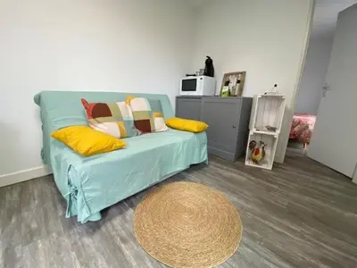 Un ou plusieurs lits dans un hébergement de l'établissement Studio de Jardin 