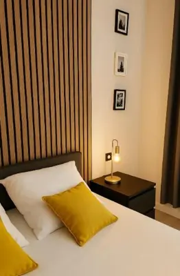 Un ou plusieurs lits dans un hébergement de l'établissement Chambres cosy proche cnpe Bugey - via rhona