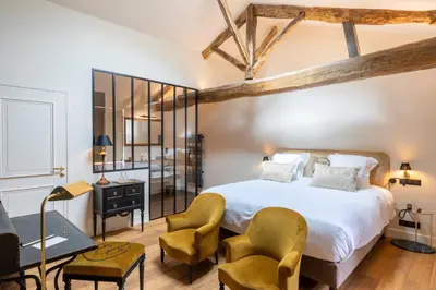 Un ou plusieurs lits dans un hébergement de l'établissement Hôtel Villa Alexandre