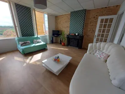 Coin salon dans l'établissement Appartement Cogny - les Meublés des Pierres Dorées