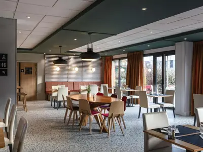 Restaurant ou autre lieu de restauration dans l'établissement ibis Lyon Est Meyzieu