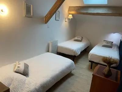 Un ou plusieurs lits dans un hébergement de l'établissement Le Clos Du Jardin